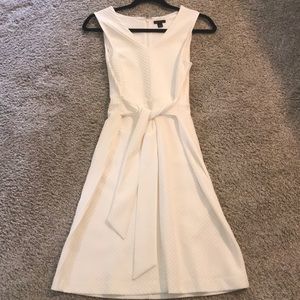 Ann Taylor cream, belted, sleeveless dress.